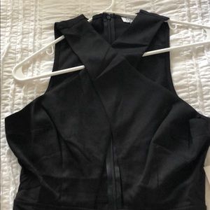 Black halter jumpsuit with opening.